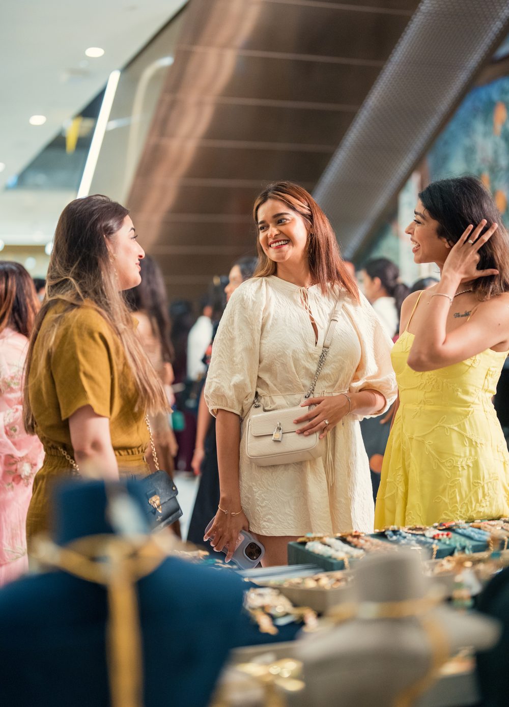 Shopper browsing curated fashion racks at The Pop Up Story